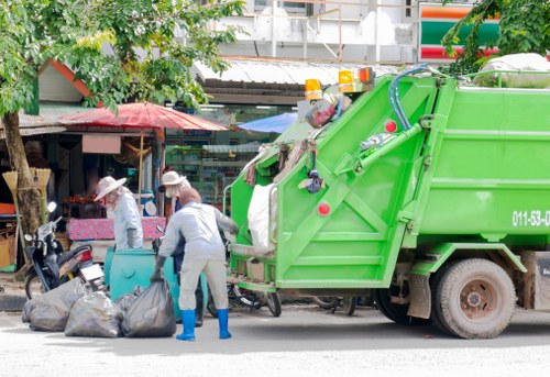 Electric collection van making a city pickup
